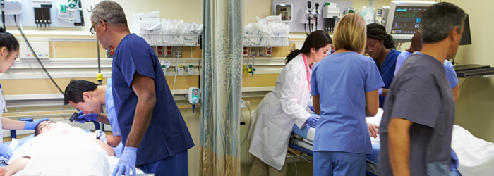 Medical team caring for two bedridden patients